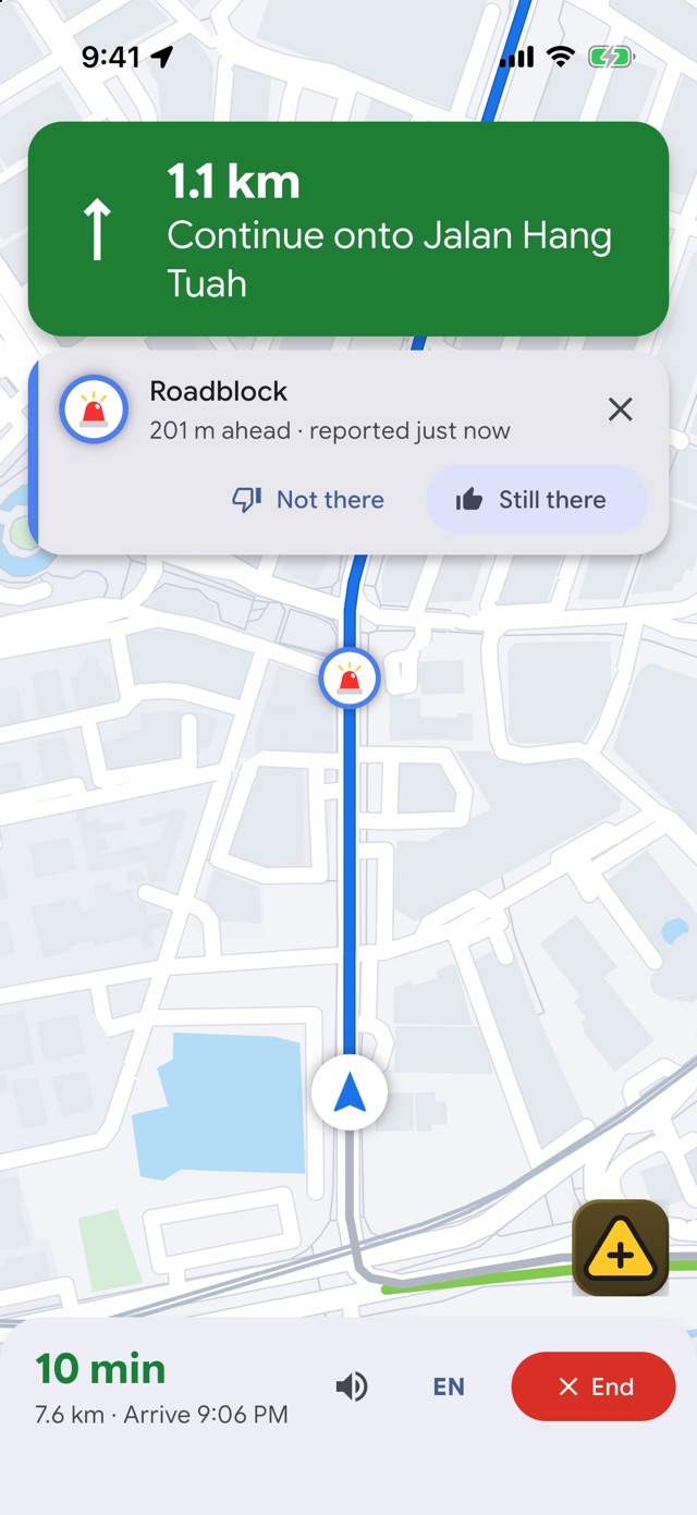 Navigation with a roadblock alert 201 m ahead and Not there and Still there buttons